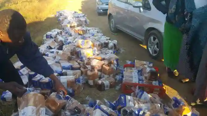 PICTURE: Illegal Bread Dealers Splash Loaves By The Roadside