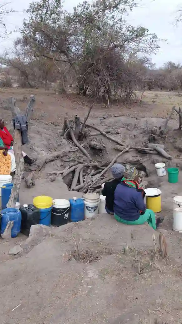 PICTURE: Rural Teachers Queue To Draw Water From A Well