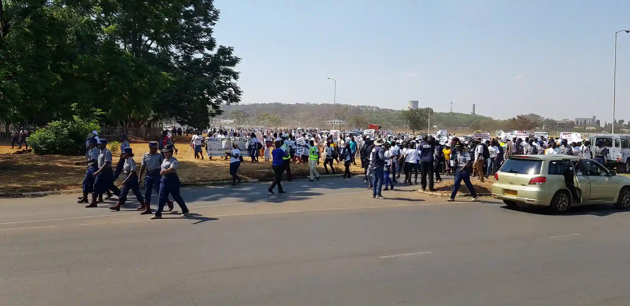 PICTURES: Anti-sanctions Marchers Walk Towards The National Sports Stadium