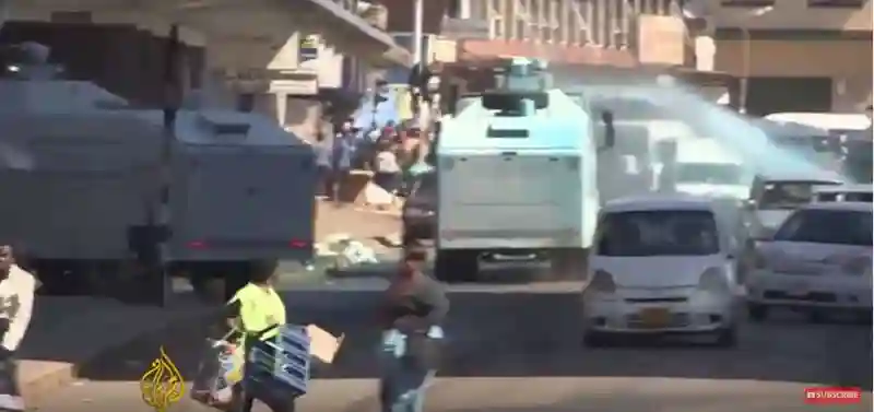 Video: Riot police fire tear gas, water cannon at protesters